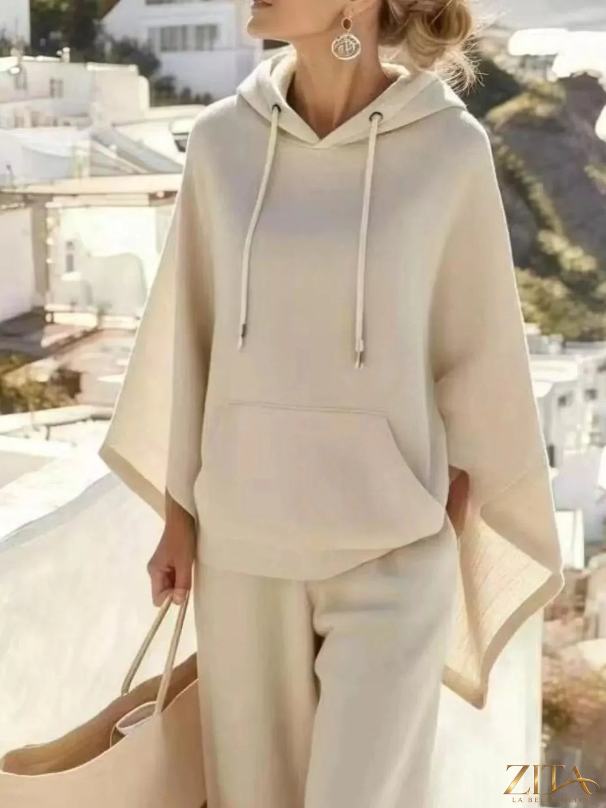 Zita La Belle Elite hooded poncho and wide-leg pants set in soft fabric, shown in stylish neutral tones.