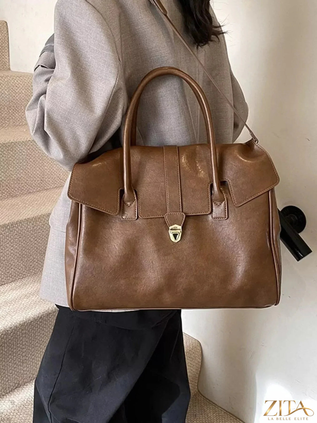 Trendsi Buckle PU Leather Handbag with adjustable strap and metal buckle, showcasing a stylish and versatile accessory.
