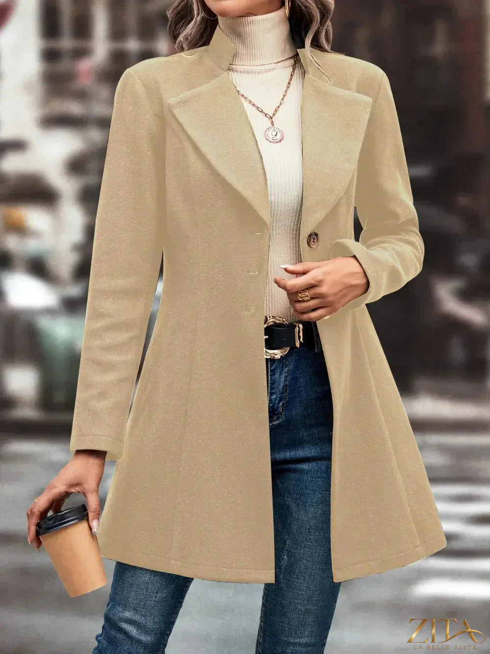 Zita La Belle Elite button-up longline coat shown on a model, featuring a classic collar and tailored fit in a neutral color.