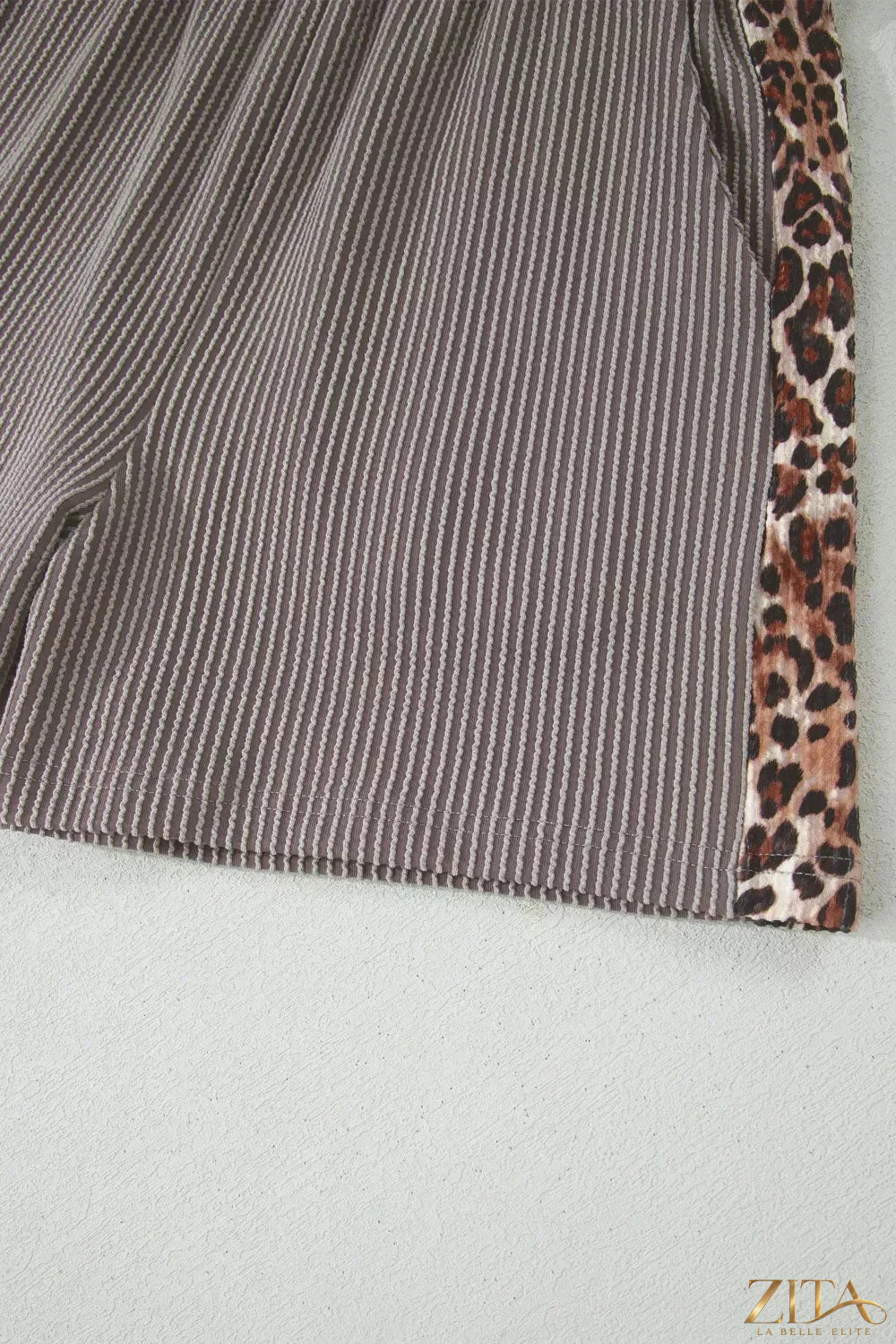 Leopard trim ribbed knit tee and shorts set by Trendsi, featuring a fitted ribbed fabric with leopard accents in a two-piece style.