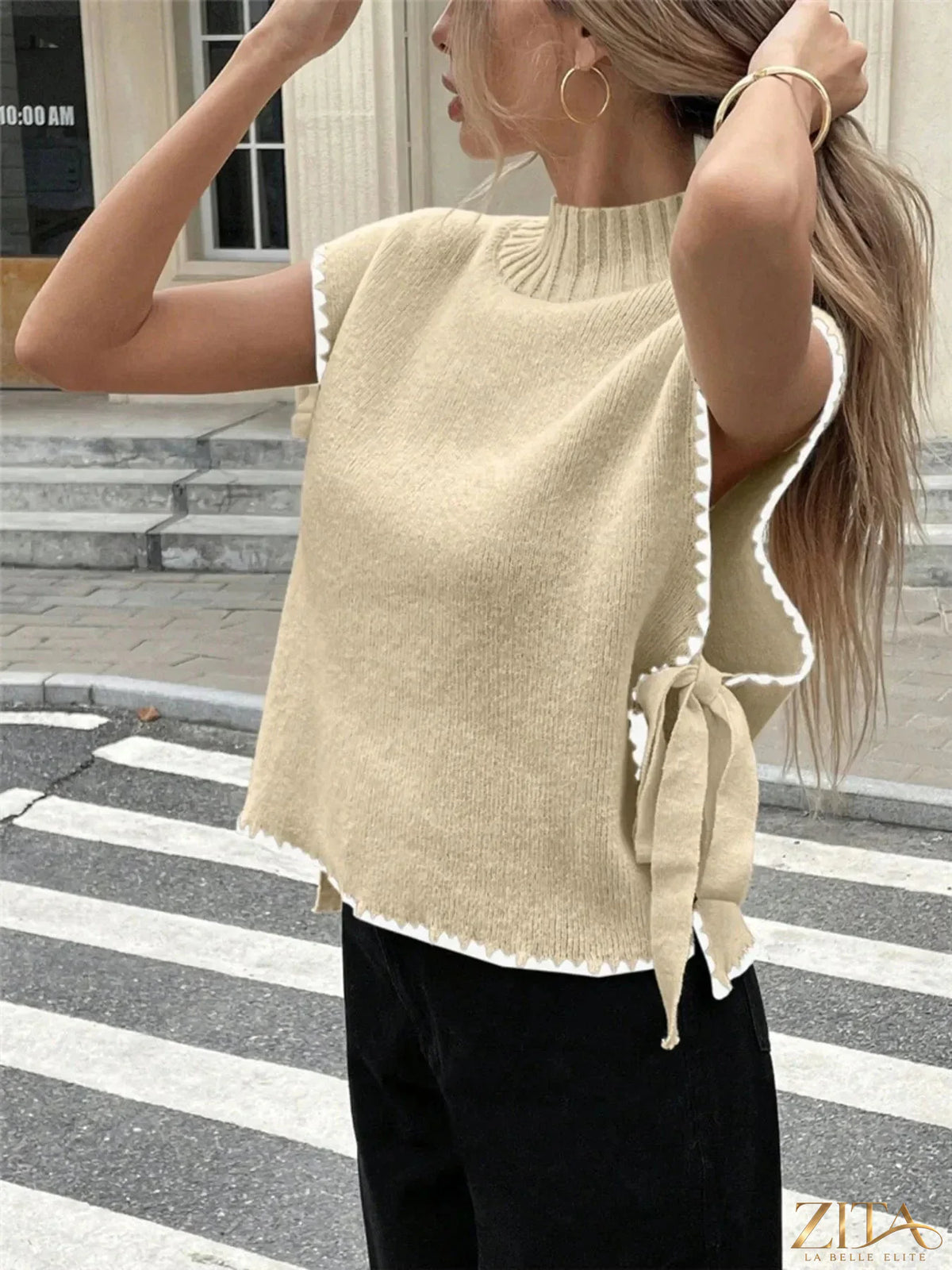 Ribbed turtleneck sweater vest with contrast trim, trendy knit top from Trendsi, featuring a snug fit and stylish design.
