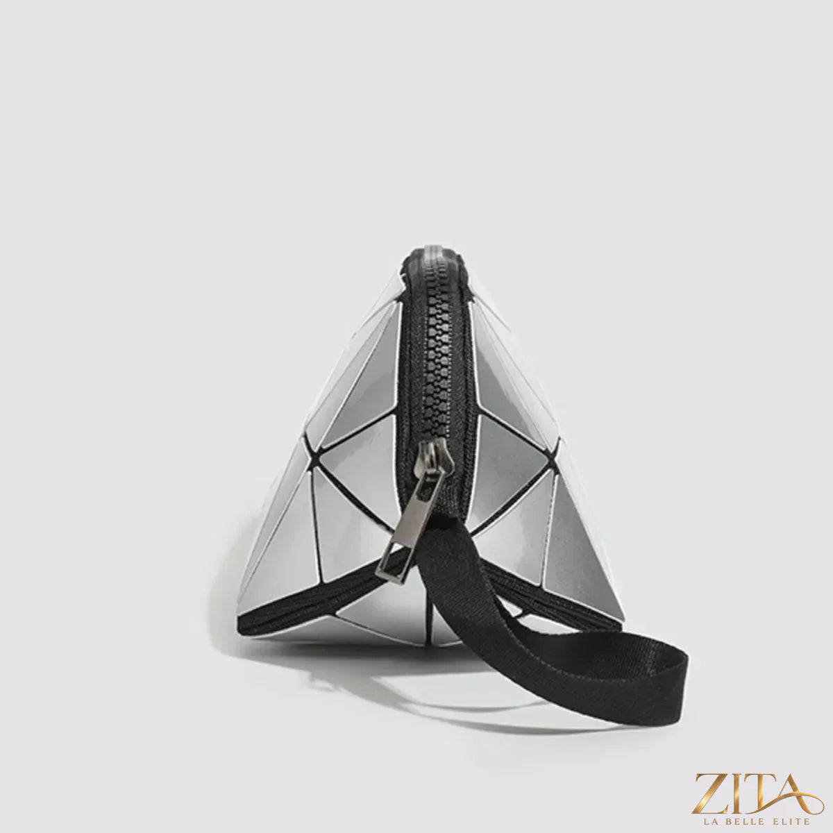 Geometric leather wristlet in neutral tones with distinctive pattern, designed by Trendsi, showcasing its stylish compact shape.