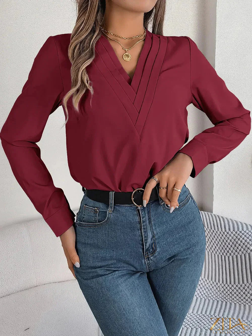 Zita La Belle Elite V-neck long sleeve blouse in soft fabric, featuring a fitted design and elegant neckline.