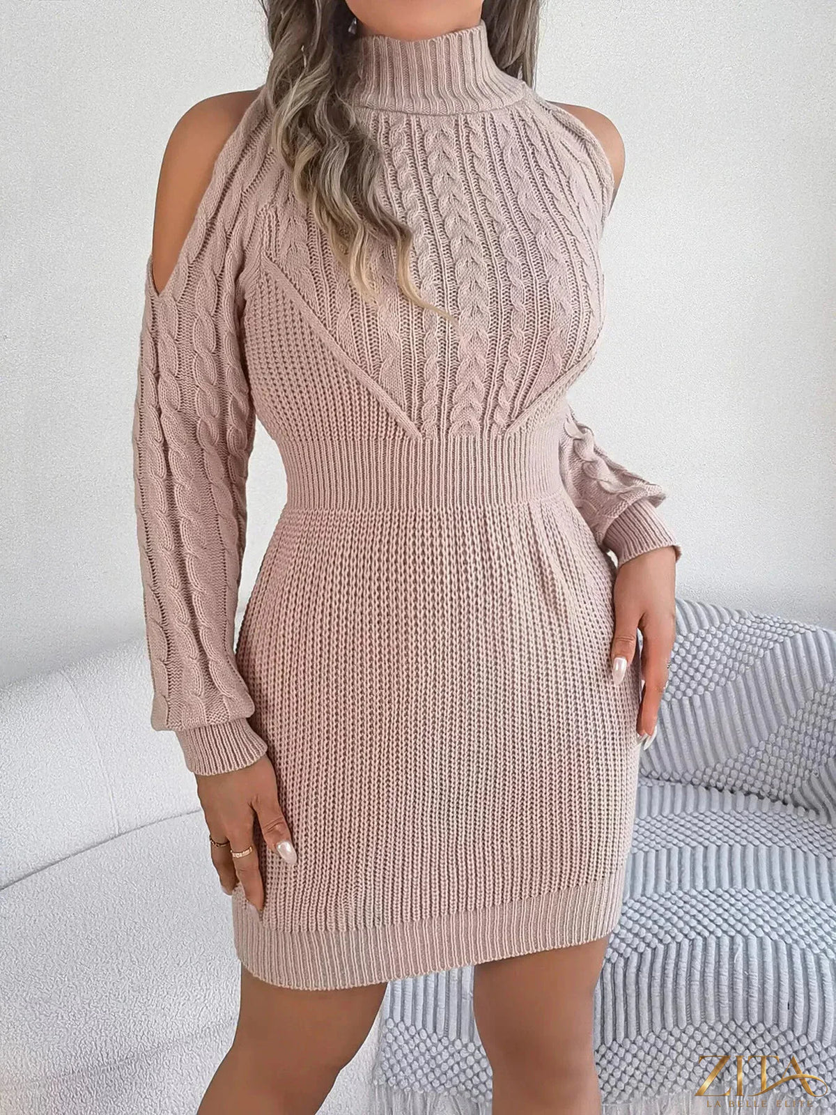 Cold shoulder cable knit turtleneck sweater dress by Trendsi, featuring a cozy knit fabric with cut-out shoulder details and a fitted silhouette.