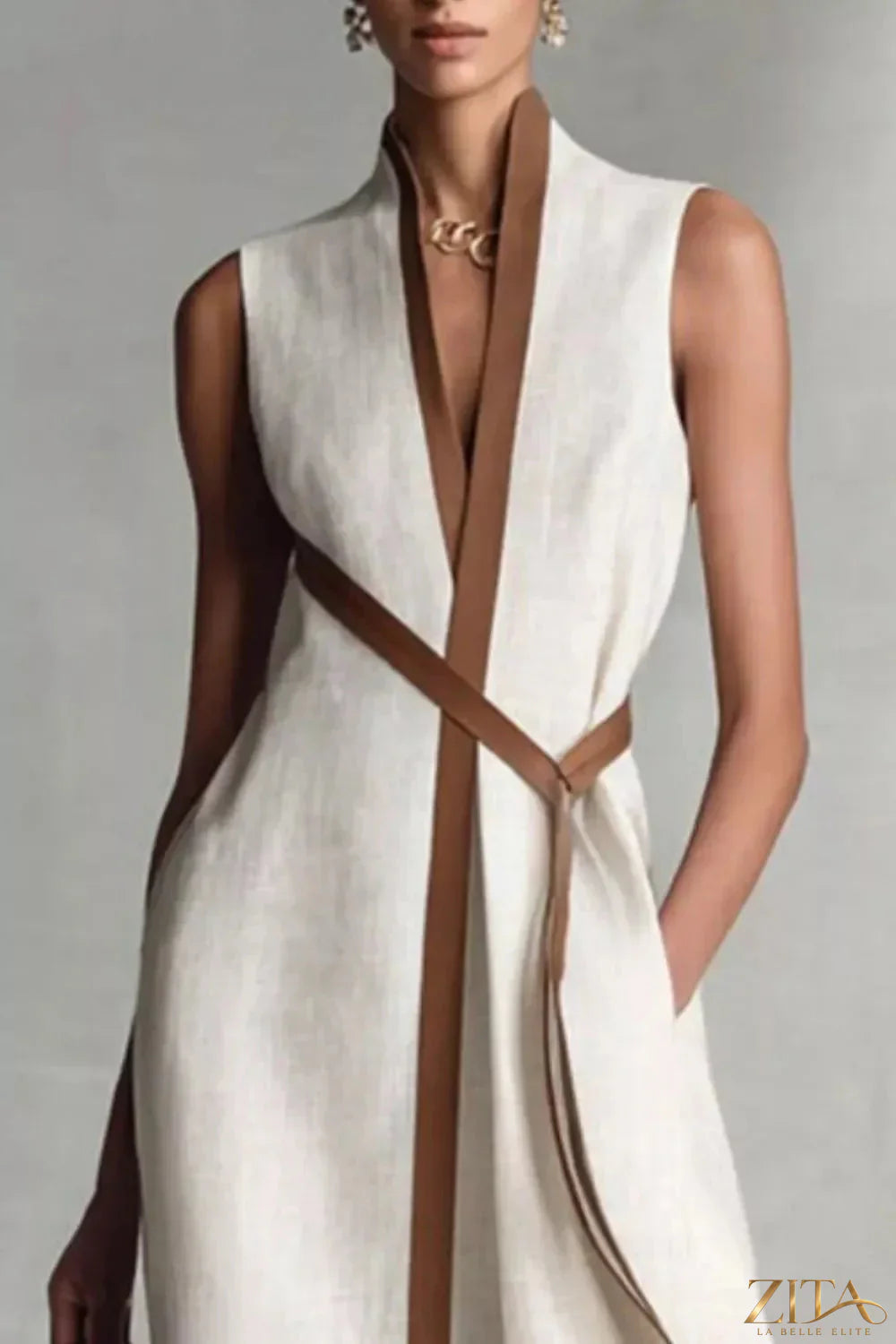Sleeveless contrast trim midi dress by Trendsi, featuring a stylish design with a fitted silhouette and bold color accents.