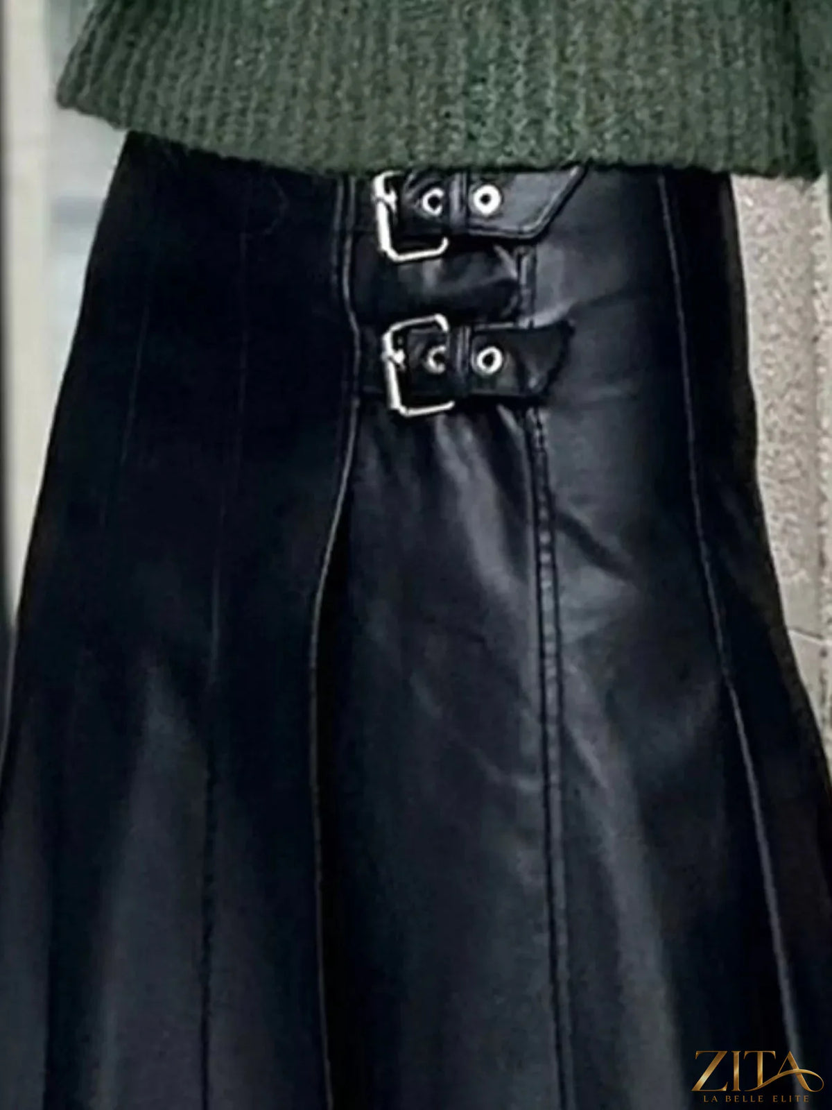 Buckle detail faux leather midi skirt from Trendsi featuring a sleek design and stylish buckle accents.