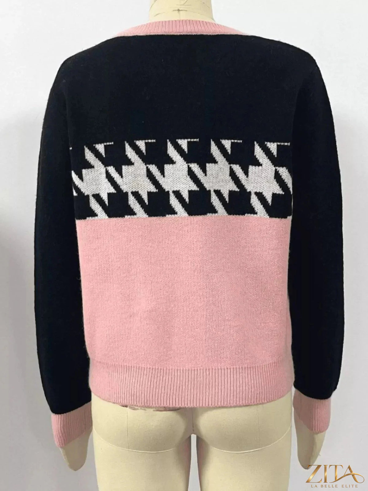 Color block houndstooth sweater from Trendsi featuring a stylish pattern and cozy knit fabric, perfect for casual wear.