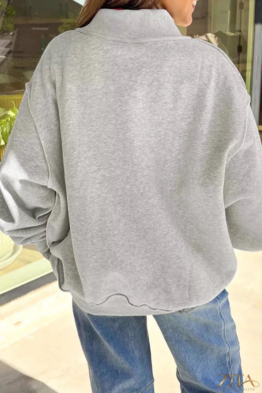 Zita La Belle Elite mock neck sweatshirt with USA slogan graphic, featuring a comfortable fit and bold patriotic design.