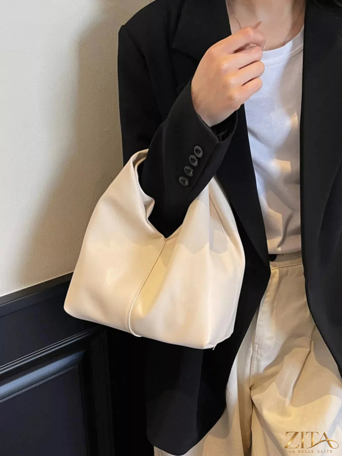 Zita La Belle Elite knot handle leather handbag with stylish design and top handle, featuring smooth brown leather and elegant details.