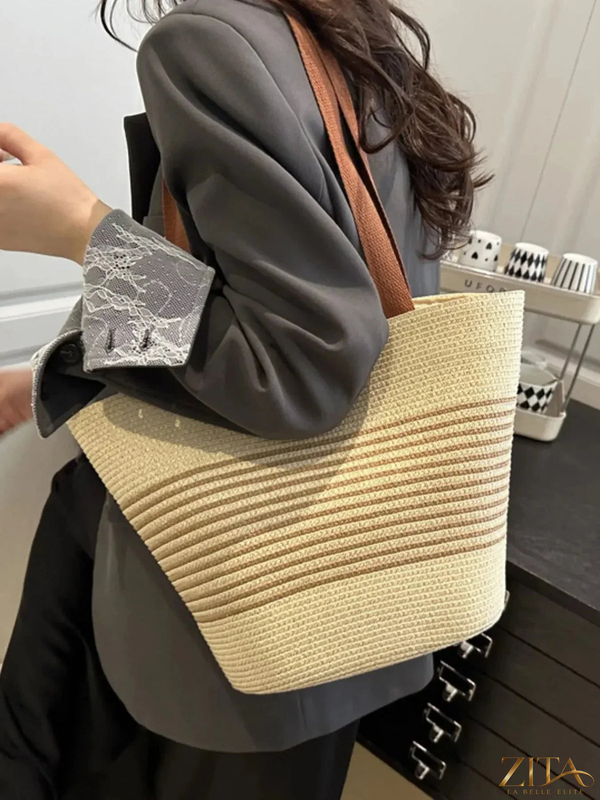 Striped woven tote bag by Zita La Belle Elite with sturdy handles and colorful striped design, perfect for casual carrying and shopping.