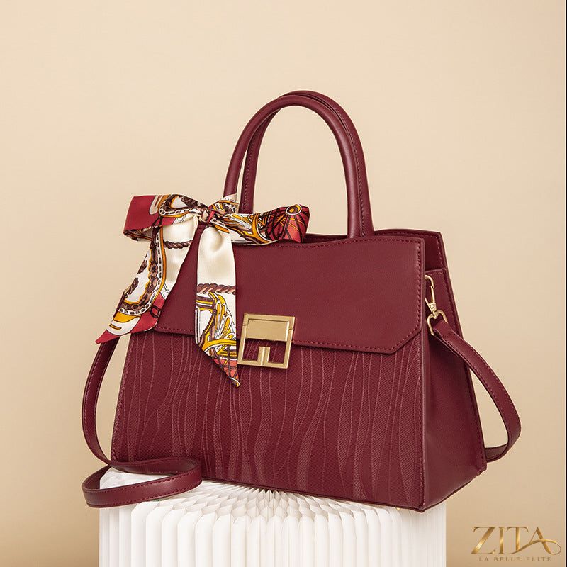 Zita La Belle Elite leather handbag with a stylish scarf decor attached, showcasing its elegant design and craftsmanship.