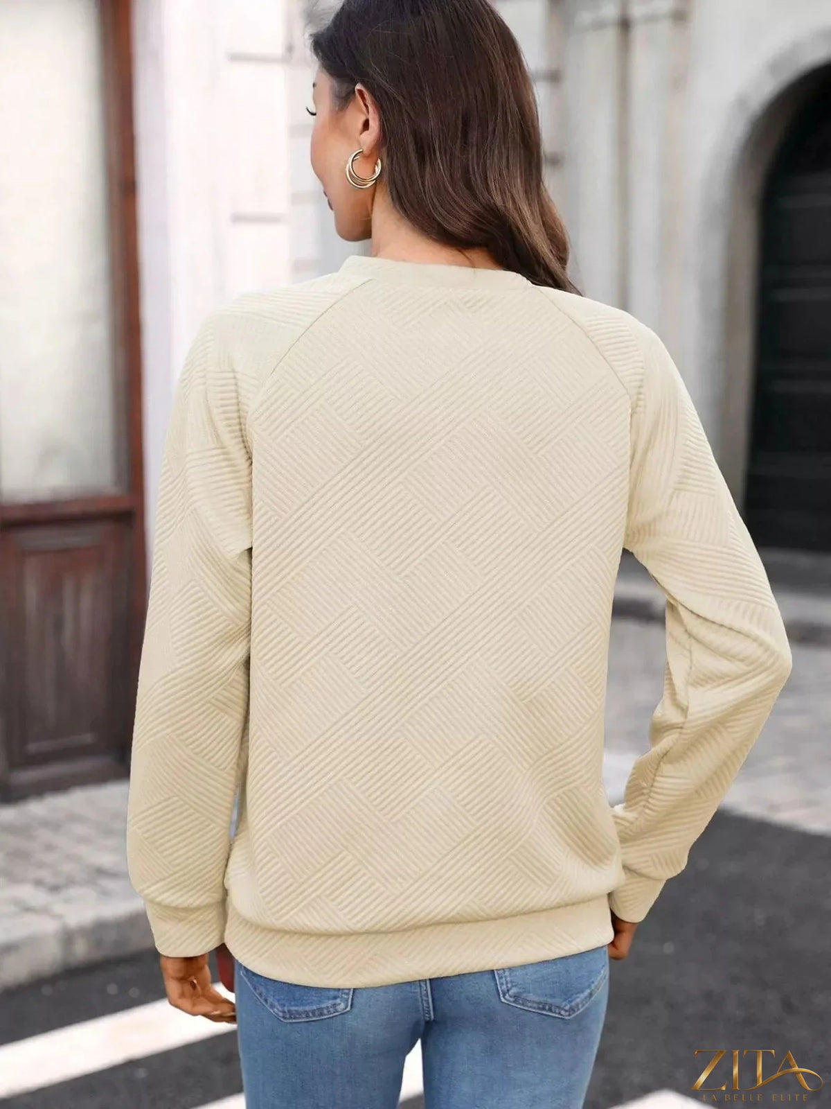 Textured notched long sleeve sweatshirt by Zita La Belle Elite, featuring a stylish design and comfortable fit.
