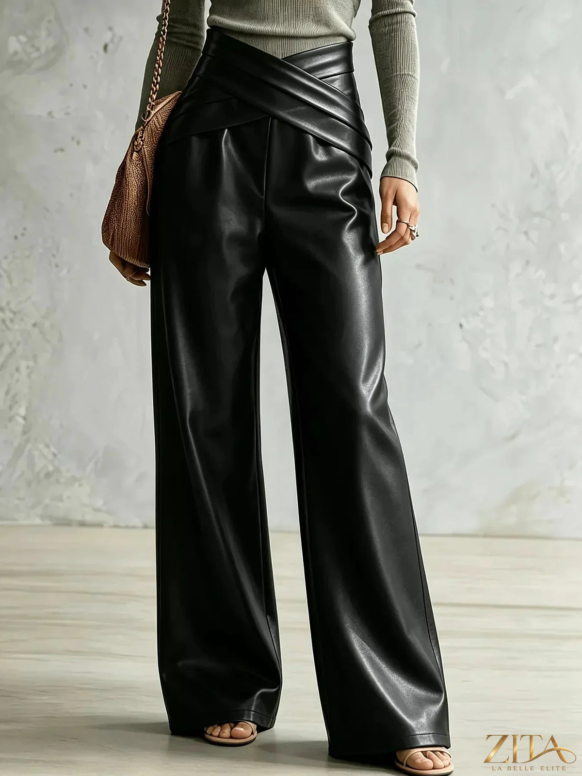 Zita La Belle Elite criss-cross wide leg pants in black fabric, featuring a high waist and flowing silhouette.