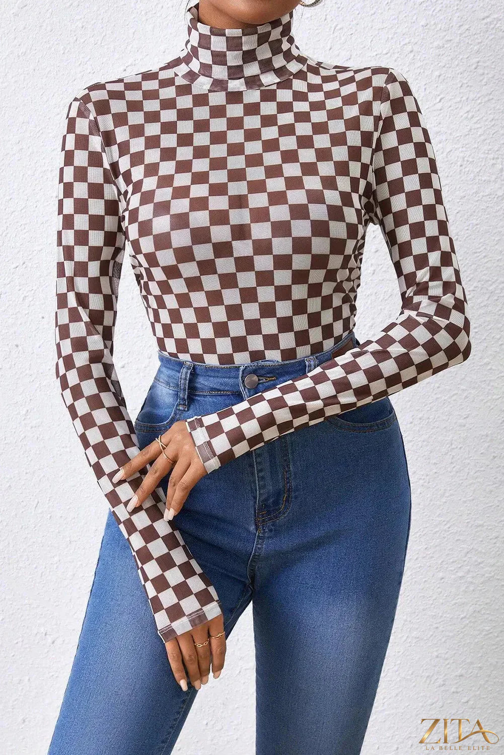 Checkered turtleneck long sleeve bodysuit by Trendsi, featuring a fitted design with a bold black and white checkered pattern.