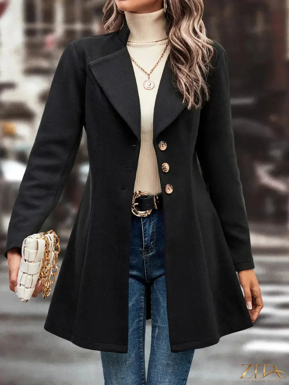 Zita La Belle Elite longline button-up coat in neutral fabric, featuring a classic collar and front buttons for a sophisticated look.