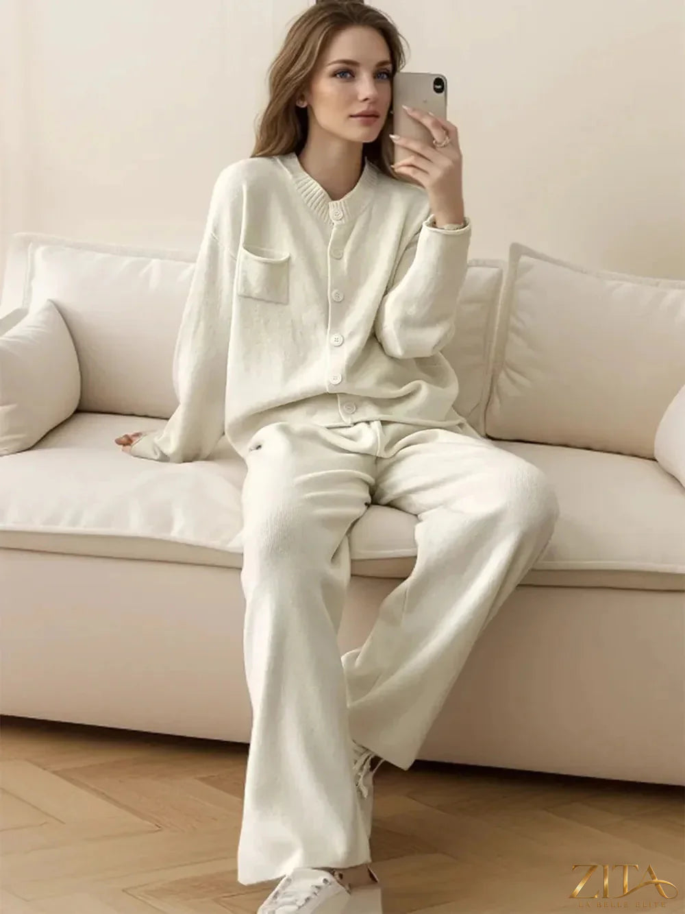Zita La Belle Elite pocketed round neck button-up cardigan and matching pants sweater set, in soft knit fabric, on a hanger.
