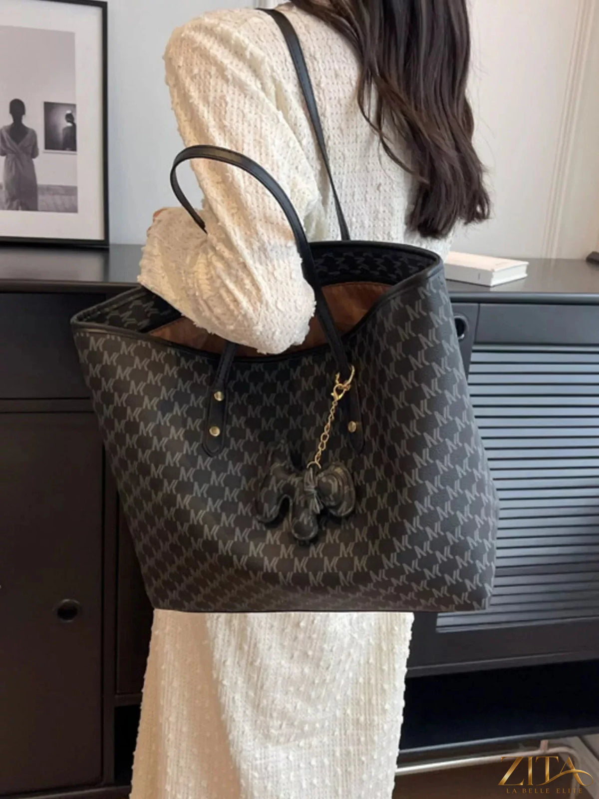 Trendsi PU leather shoulder bag with adjustable strap, stylish design, and spacious interior for everyday use.