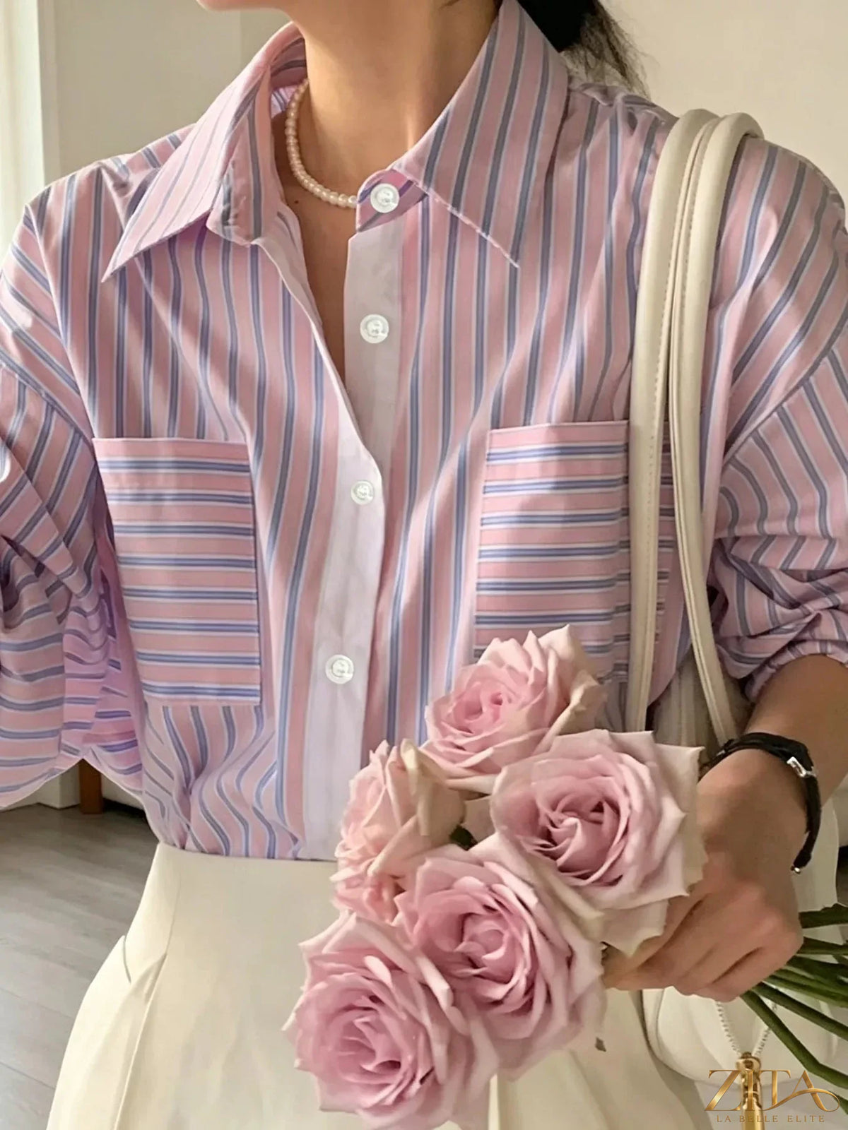 Zita La Belle Elite striped button-down shirt with blue and white vertical stripes, long sleeves, and classic collar.