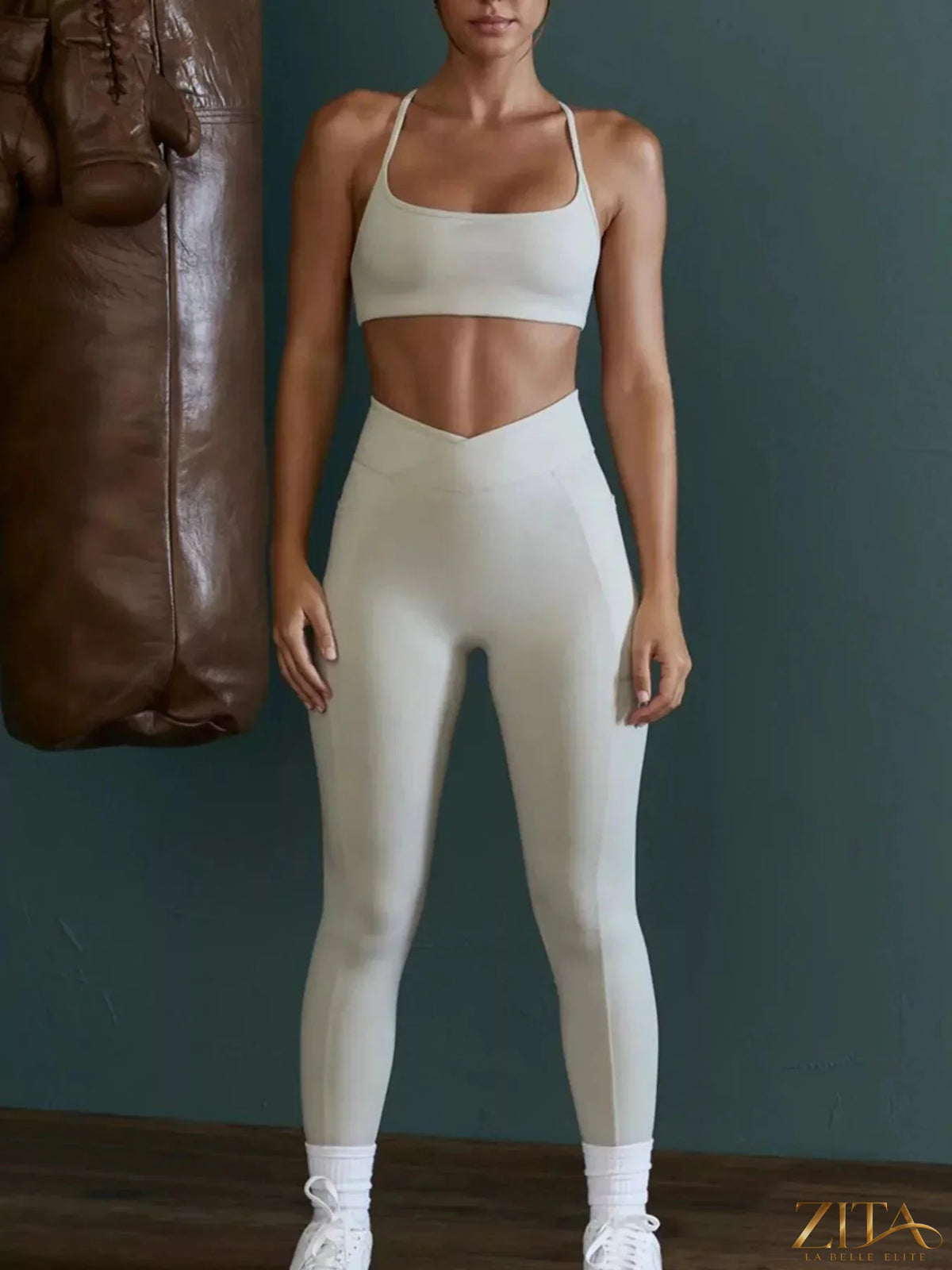 Zita La Belle Elite seamless cross-waist cami and leggings active set, showing the matching black workout top and high-waisted leggings.