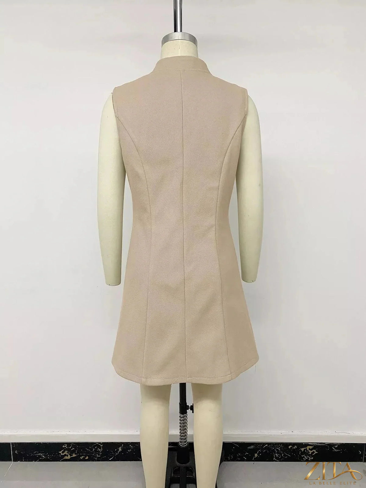 Elegant button-down vest coat by Zita La Belle Elite, featuring a tailored fit and classic design in neutral fabric.