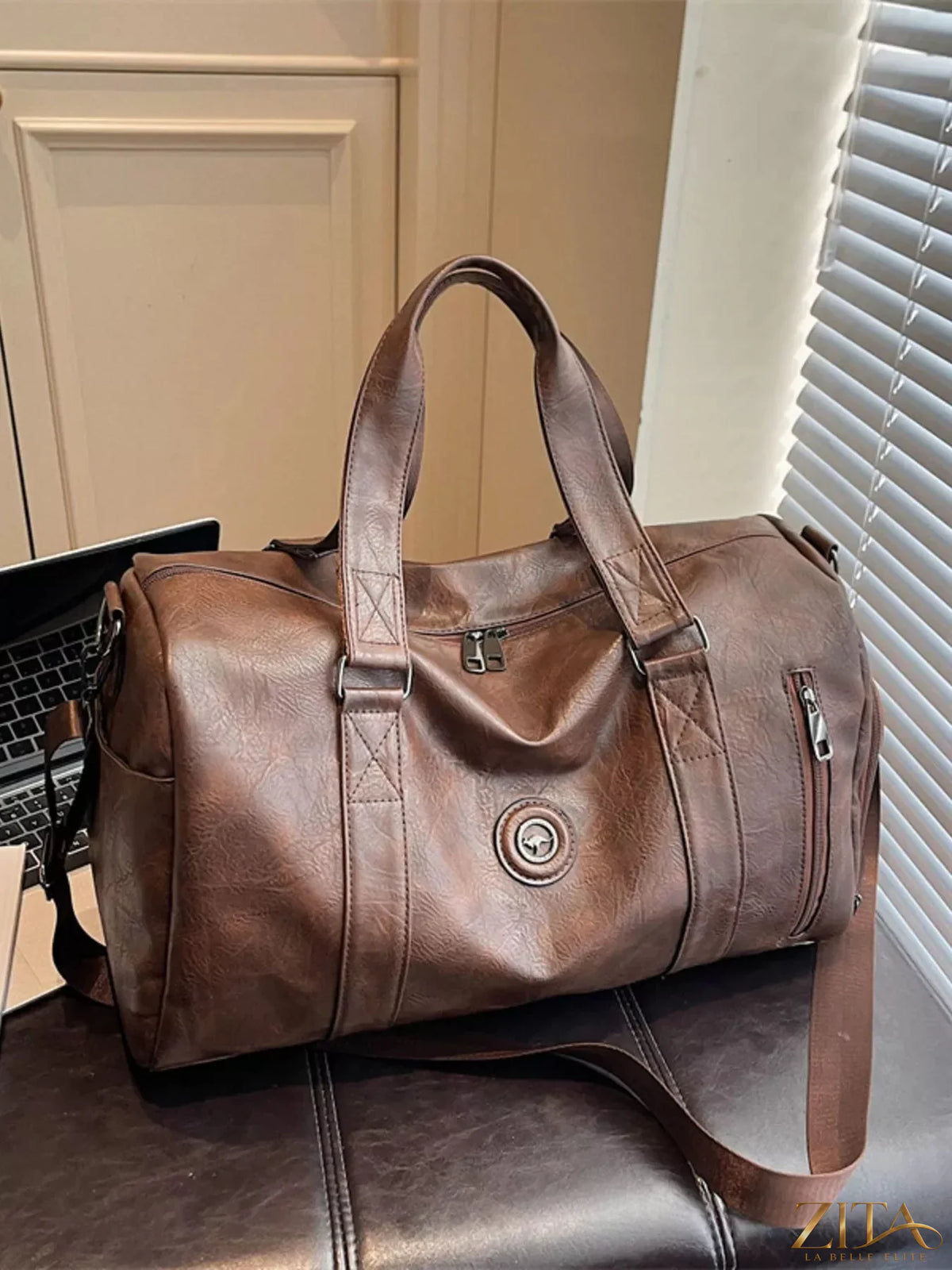 Trendsi PU leather duffel bag with sturdy handles and spacious interior, perfect for travel or gym use.