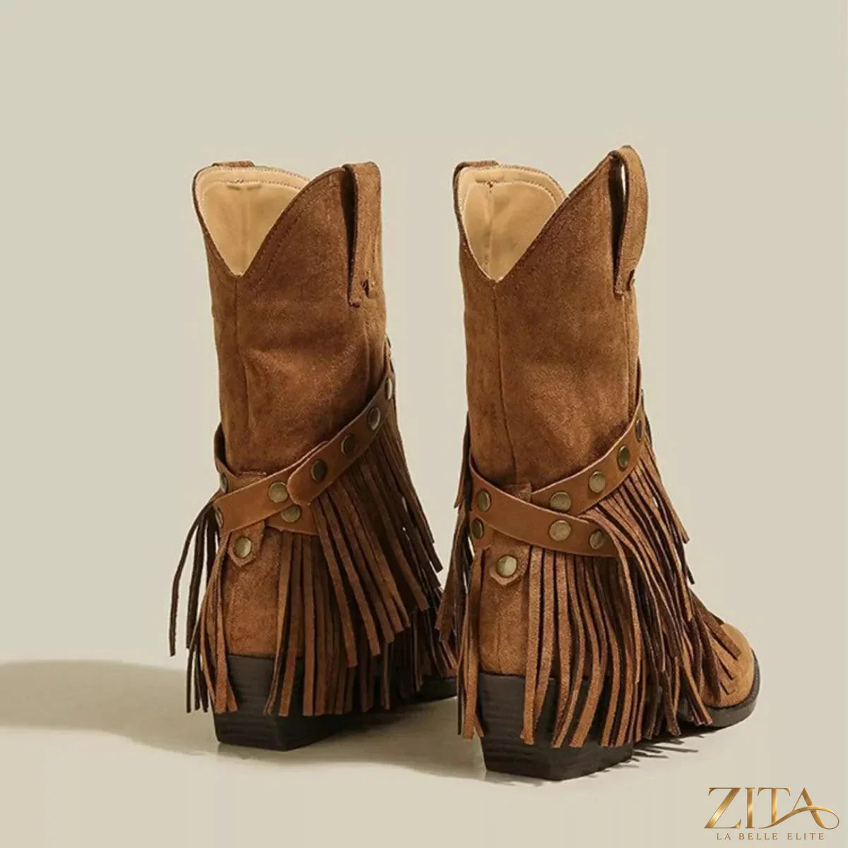 Vintage suede Western fringe boots by Zita La Belle Elite with studded straps and detailed fringe design.
