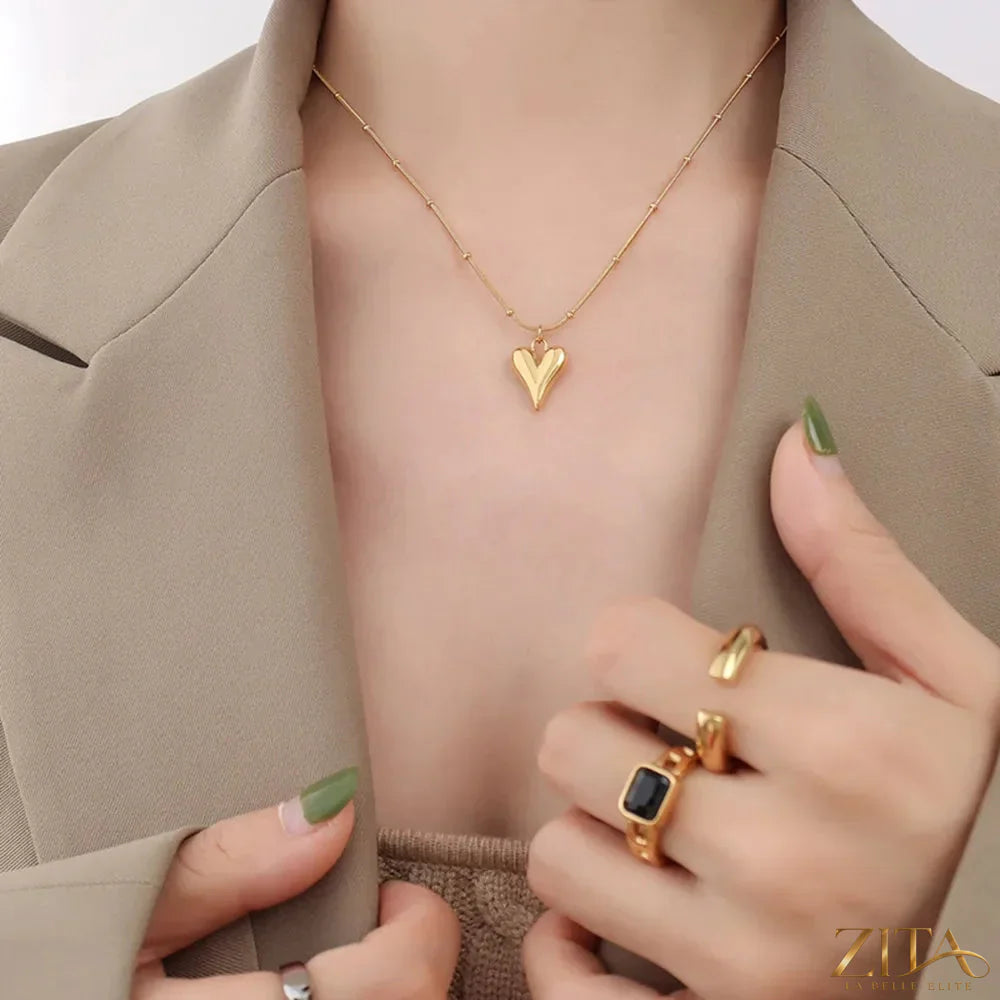 Titanium steel heart pendant necklace by Zita La Belle Elite, showing a sleek heart-shaped pendant on a chain.