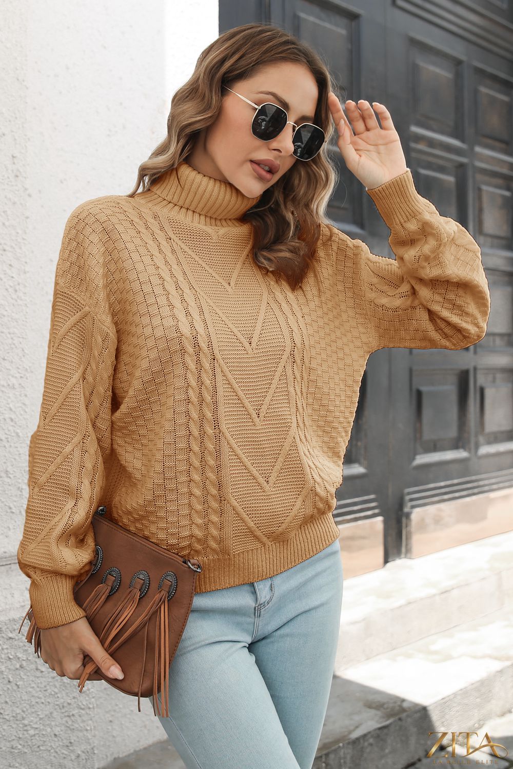 Cable-knit turtleneck sweater by Zita La Belle Elite, featuring a cozy, textured knit pattern in a classic design.