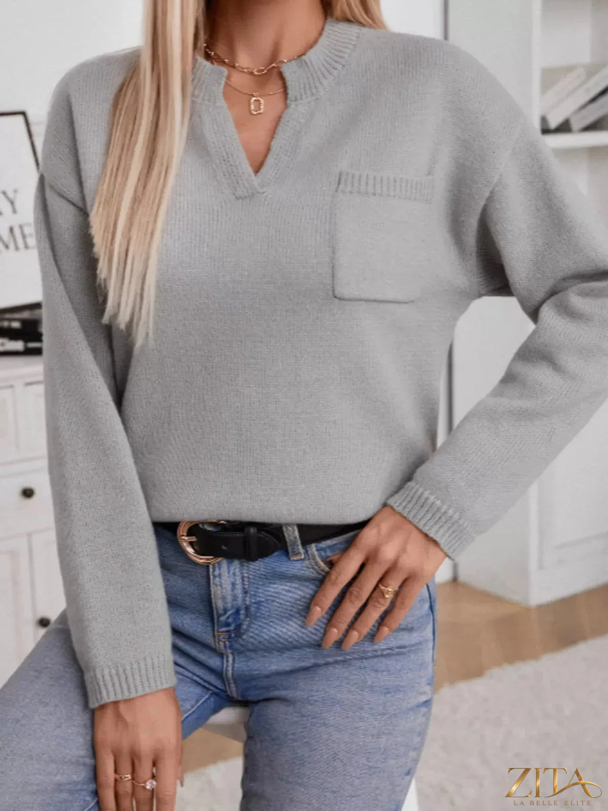 Trendsi notched dropped shoulder sweater in soft knit fabric, featuring a relaxed fit and stylish design, shown in a neutral color.