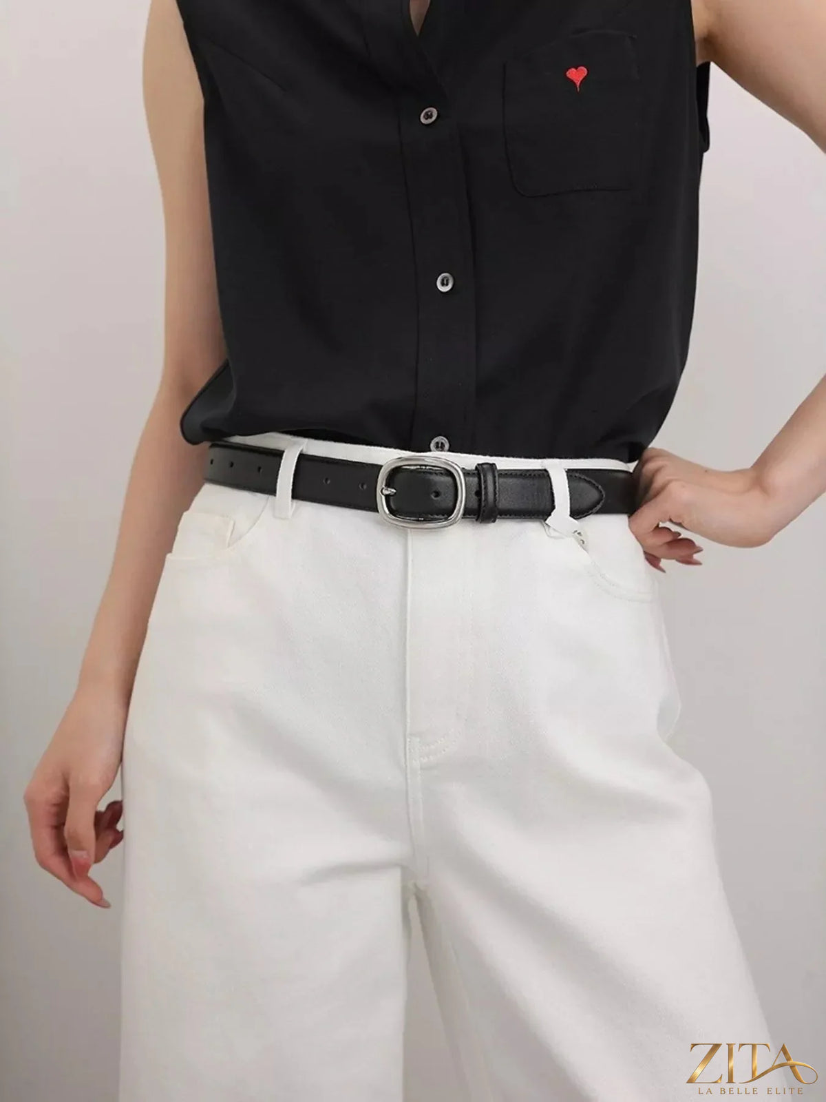 Leather belt with an oval buckle from Trendsi, featuring a smooth finish and classic design.
