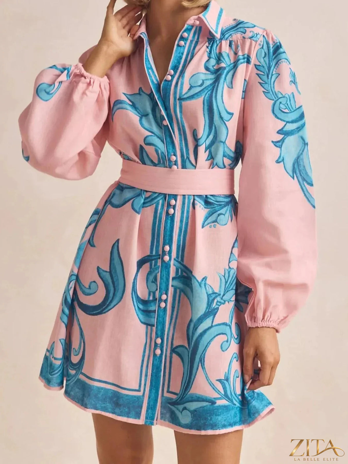 Printed long sleeve shirt dress by Trendsi featuring a casual, stylish design with a button-up front and relaxed fit.