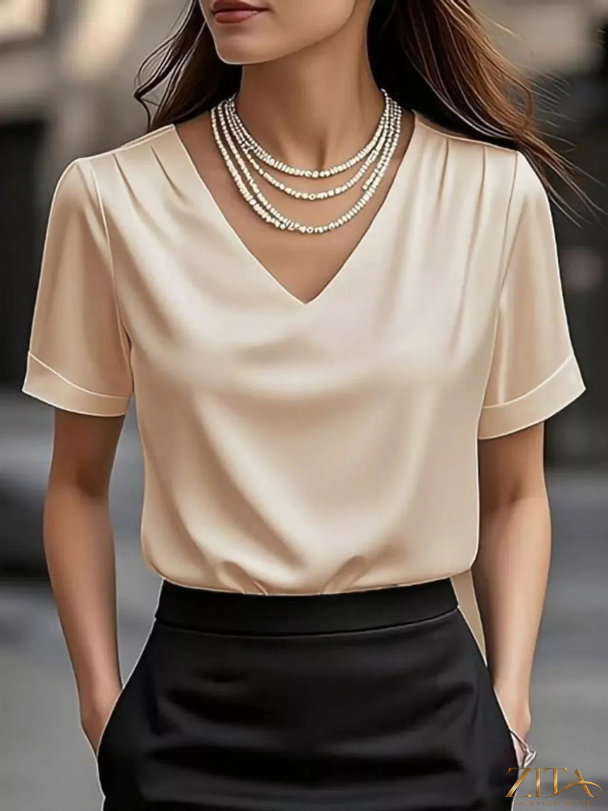 Zita La Belle Elite V-neck short sleeve satin blouse with a smooth, shiny fabric and elegant fit.