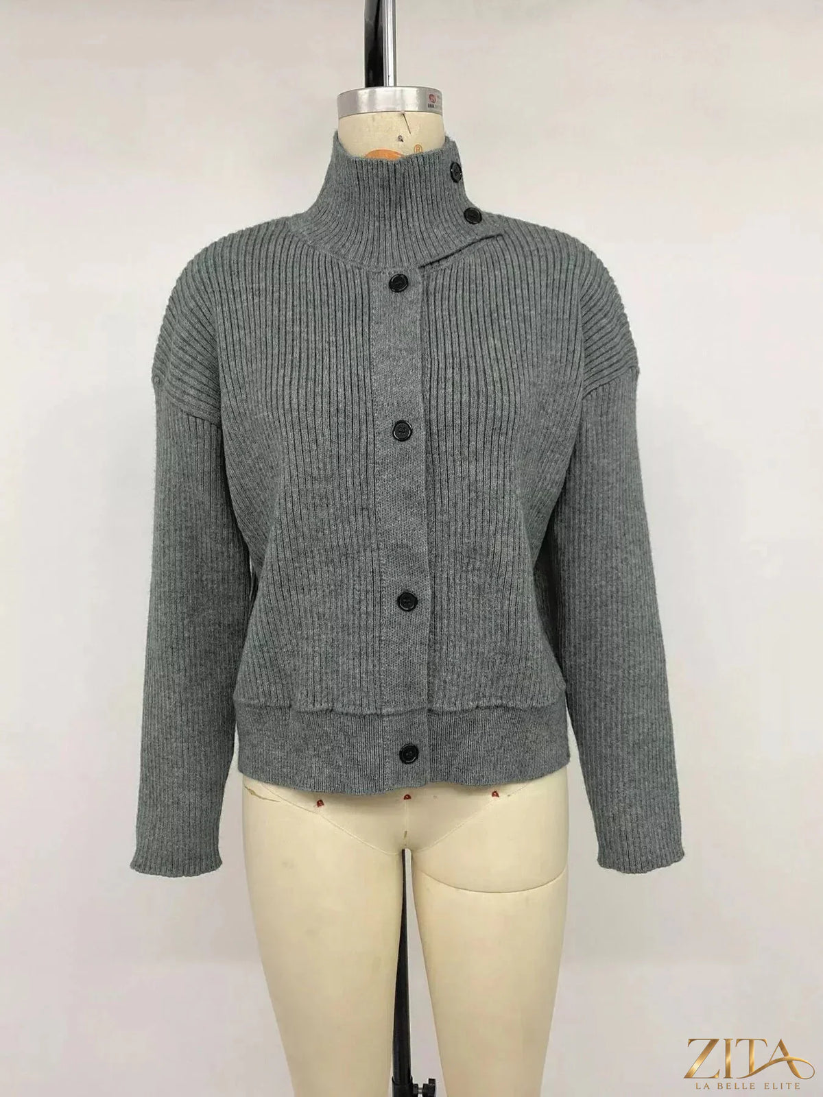 Zita La Belle Elite turtleneck button-down cardigan, beige knit with front buttons and ribbed cuffs, close-up of fabric and design.