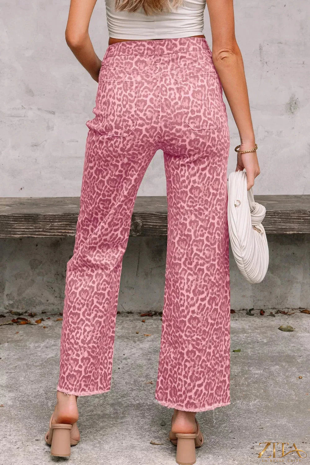 Leopard print frayed edge wide-leg high-waist jeans by Zita La Belle Elite, showing the stylish distressed hem and relaxed fit.