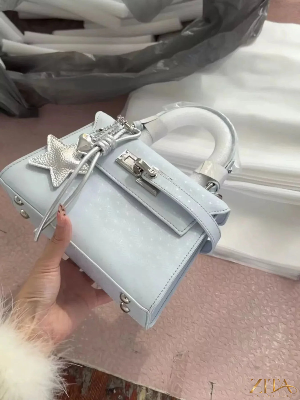 Trendsi PU leather mini handbag with gold-tone hardware, featuring a sleek design and a top handle for stylish carrying.