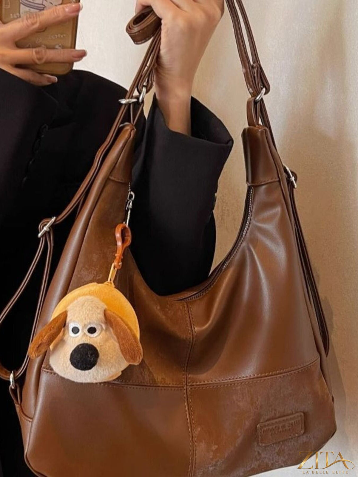 Vintage style hobo shoulder bag by Zita La Belle Elite with leather finish and adjustable strap, displayed on a neutral background.