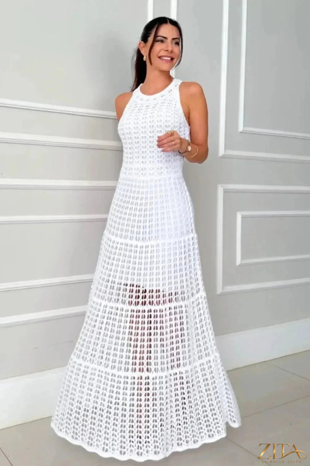 Zita La Belle Elite hollowed-out sleeveless maxi dress with cut-out details and flowing fabric, styled for a modern, elegant look.