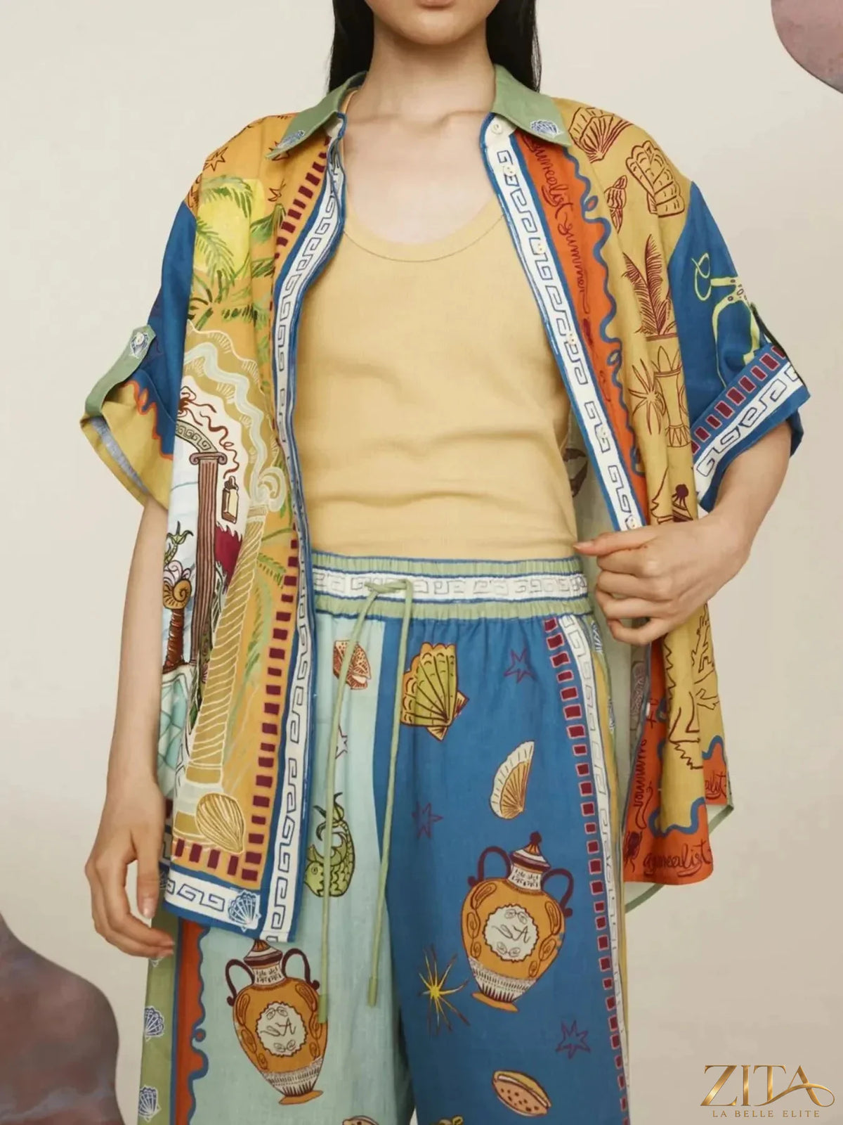 Zita La Belle Elite printed button-up shirt and matching pants set, featuring colorful floral design on lightweight fabric.