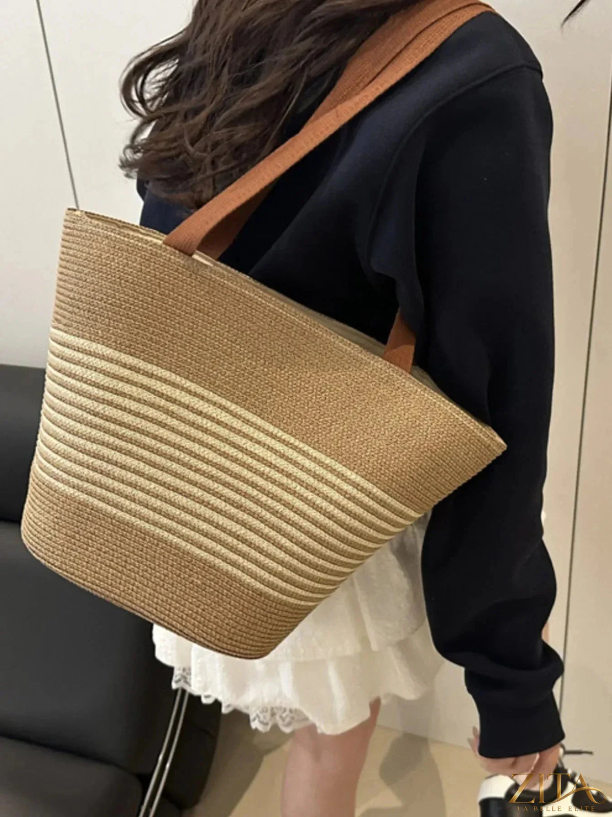 Striped woven tote bag by Zita La Belle Elite with colorful horizontal stripes and sturdy handles, perfect for casual outings.