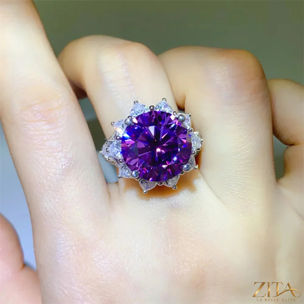 Sterling silver flower-shaped ring adorned with a 10-carat moissanite gemstone, featuring intricate floral design and sparkling detail.