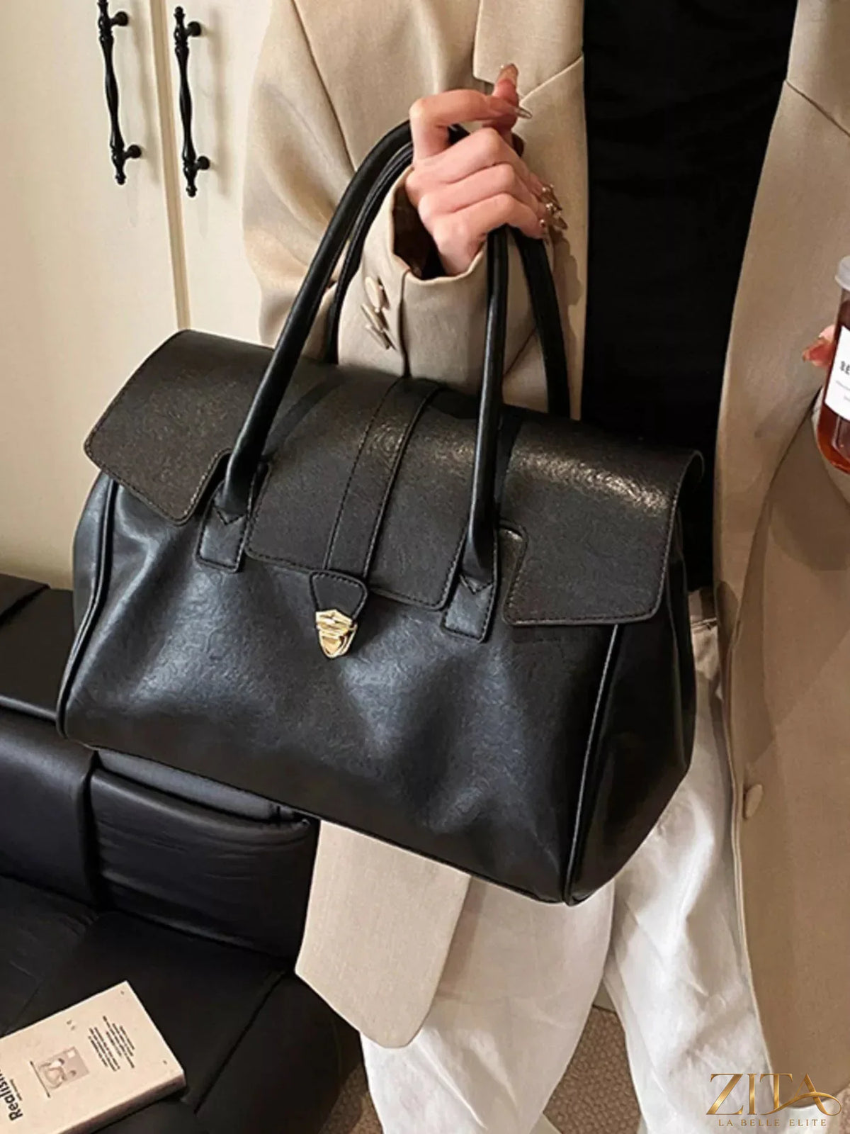 Trendsi buckle PU leather handbag with a stylish design, featuring a front buckle detail and a spacious interior.