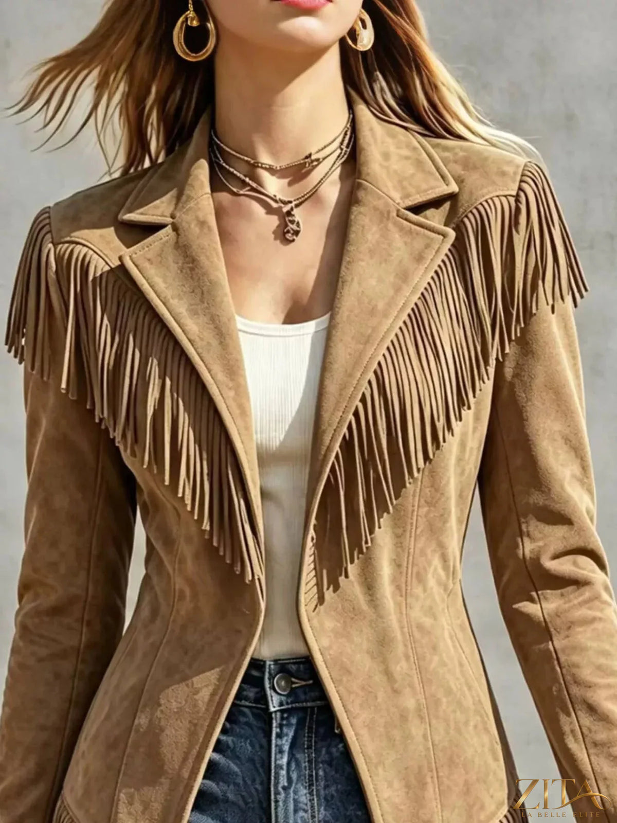 Western-inspired fringed open front jacket by Trendsi, featuring suede-like material and detailed fringe accents.