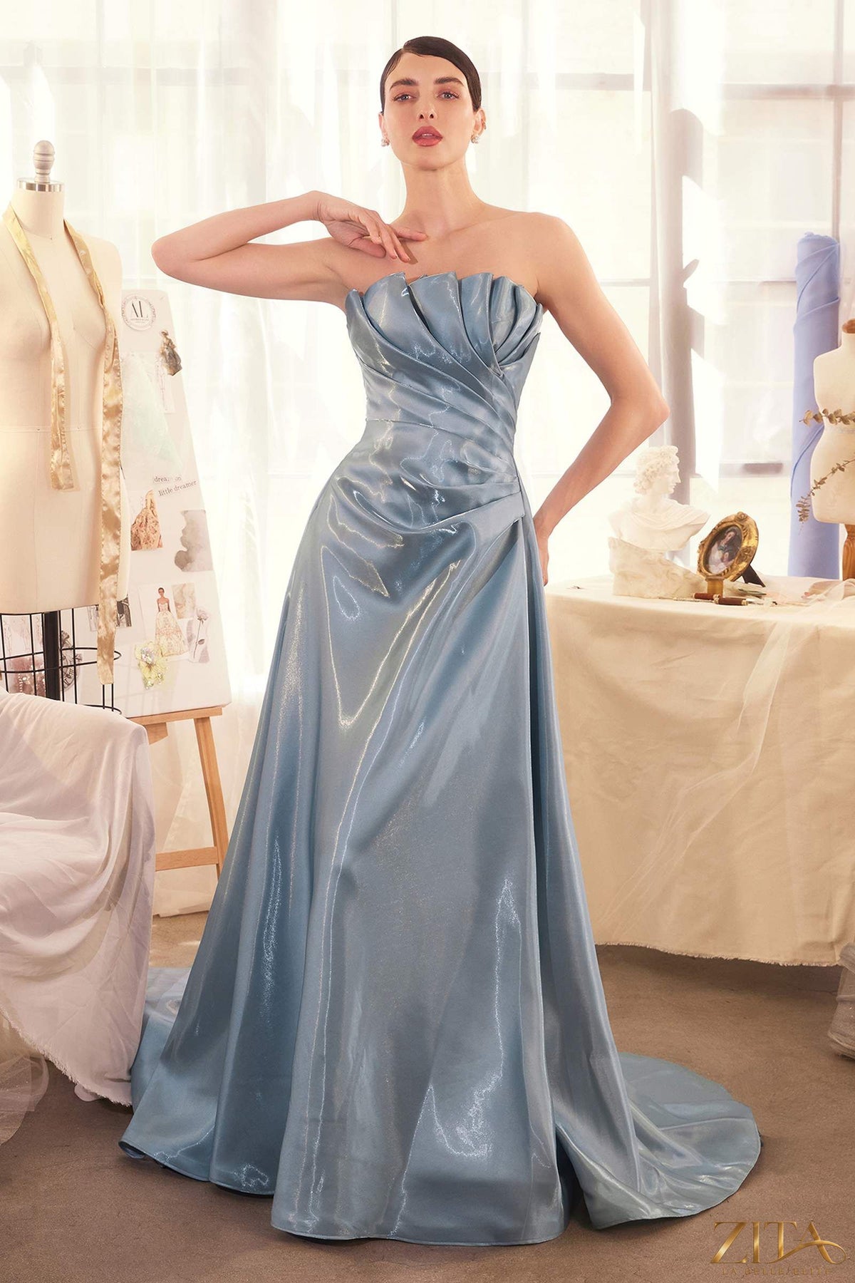 Zita La Belle Elite pleated origami liquid taffeta gown in smoky blue, front view showcasing elegant design and flowing fabric.