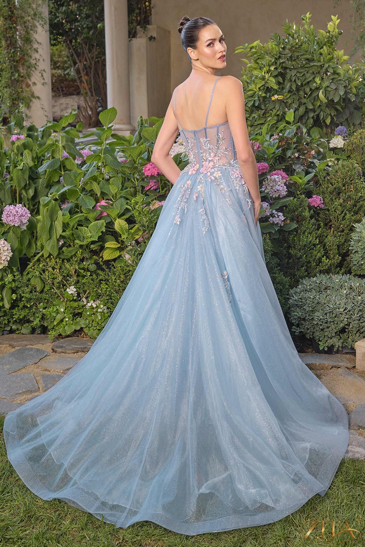 Blue strapless prom ball gown by Zita La Belle Elite, elegant dress with a flowing skirt and intricate design.
