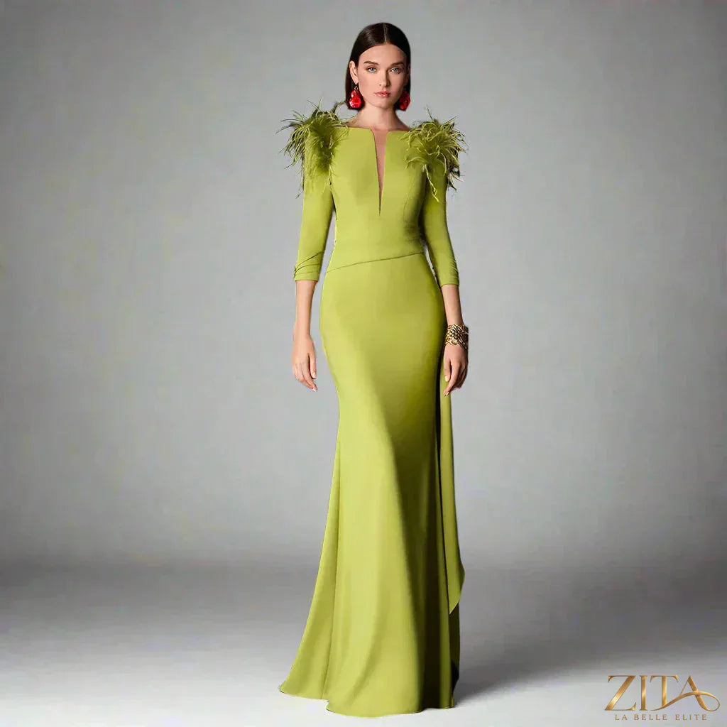 Women’s satin evening dress by Zita La Belle Elite featuring feather ruffles, button details, and a long, elegant formal gown.