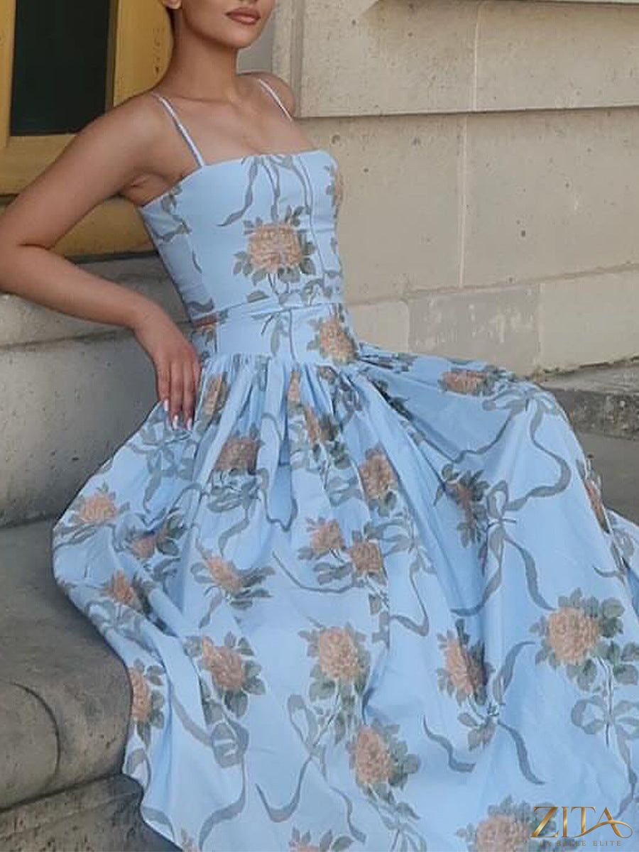 Fitted strapless backless maxi dress by Zita La Belle Elite featuring a printed design, long flowing silhouette, and elegant style.