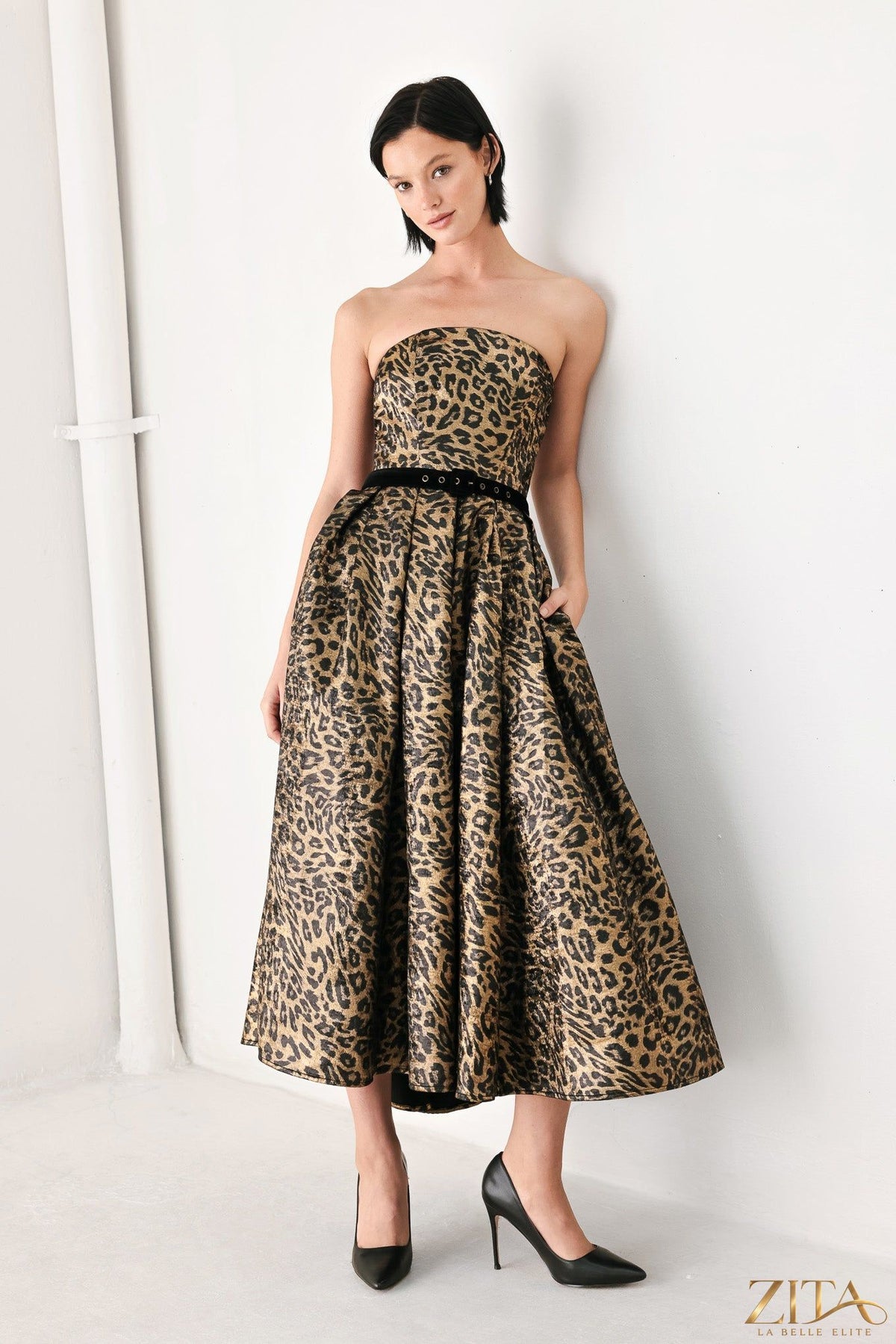 Wildly Golden Leopard strapless midi dress by Zita La Belle Elite, featuring a gold and black leopard print fabric and fitted silhouette.