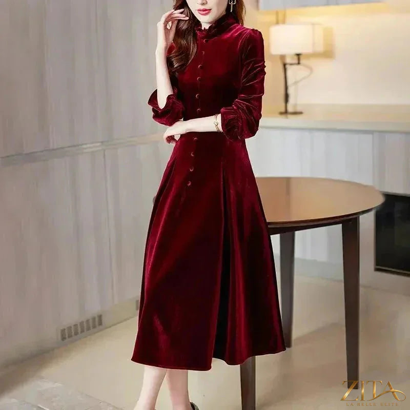 Wine red velvet women’s maxi dress with long sleeves by Zita La Belle Elite, featuring a flowing, elegant design.