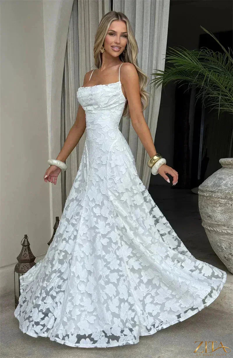 Elegant backless women's evening gown with spaghetti straps and lace-up design by Zita La Belle Elite, perfect for formal events.