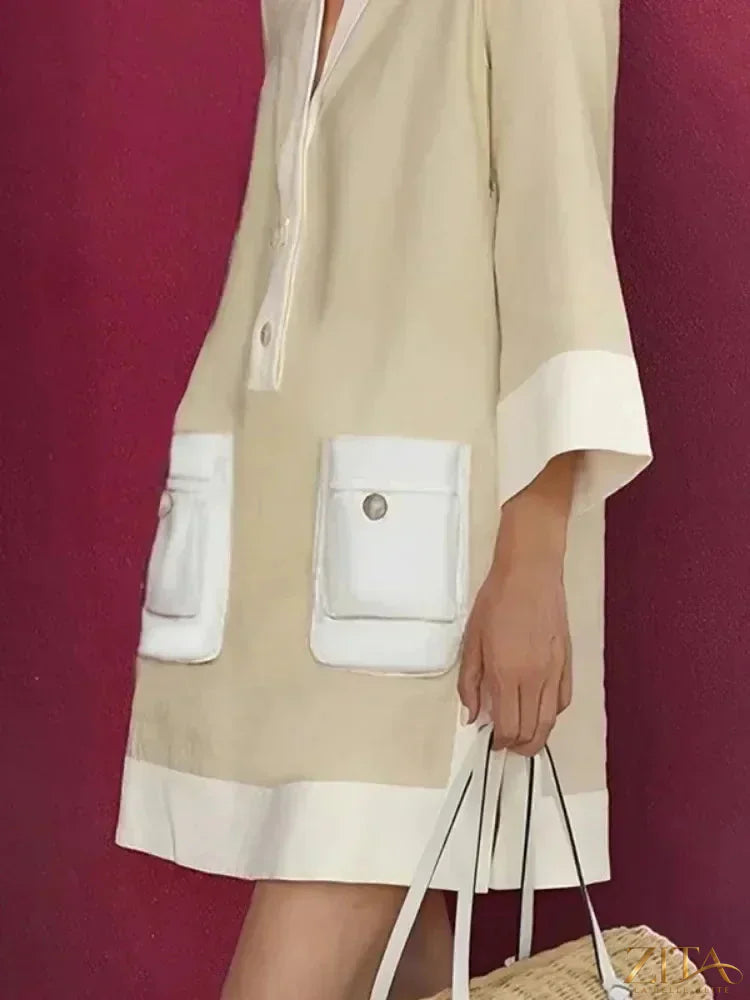 Zita La Belle Elite contrast color button-down shirt mini dress with long sleeves and a fitted silhouette.